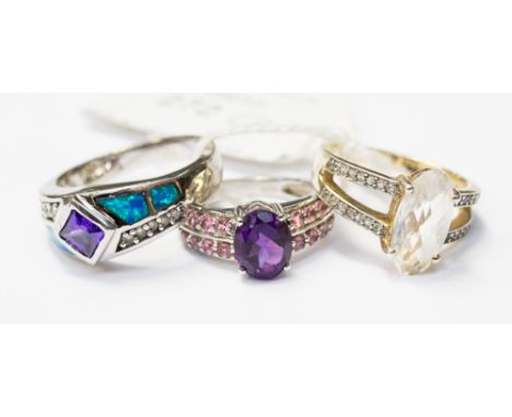 A silver ring set with an amethyst, triple opal and white topaz, size S, together with a silver ring set with an amethyst and