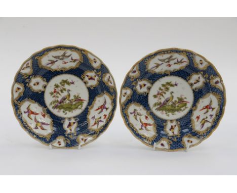 Pair of Worcester cabinet plates, hand painted with birds and insects in cartouche, shaped and gadrooned gilded rims, circa 1