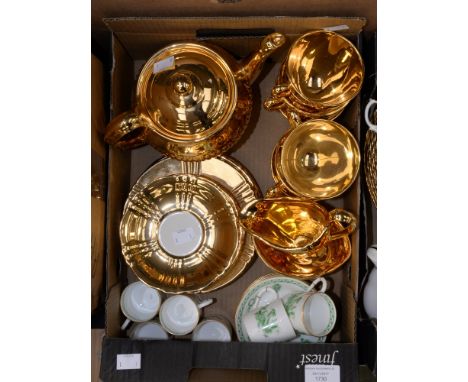 A set of six Royal Worcester coffee cans and saucers, white ground, decorated with jade green chinoiserie pattern, including 