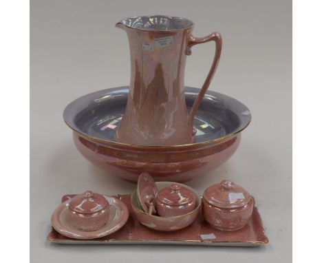 A 1930s Crown Ducal pink lustre wash jug and basin with matching dressing table set