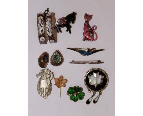 A group of enamel jewellery including a guilloche bar brooch with floral detail, an enamelled swallow brooch af, a four leef 