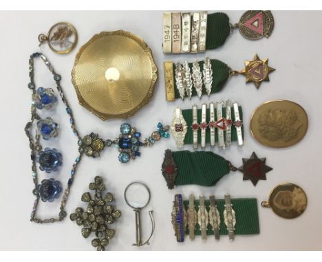 A collection of costume jewellery comprising two rolled gold picture lockets, a carved lava cameo brooch (damaged gold and mi