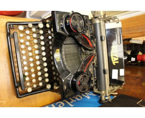 A Royal typewriter, Like-Nu Regal, double reel action, black painted case, complete with original cover 