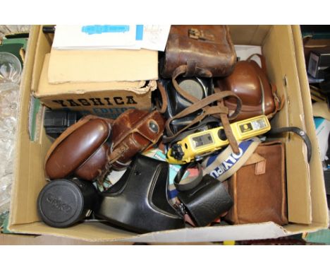 A pair of Edwardian (1920) leather cased binoculars, a German post World War Two Paxette brown camera, leather cased Kodak Ol