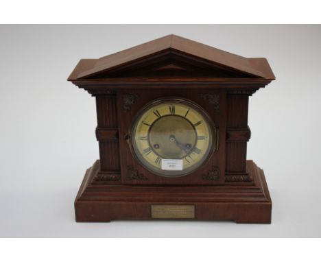 An early 20th Century oak mantle clock, with inscribed plaque dated 1902