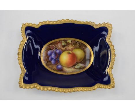 A Royal Worcester pin dish, signed by Richard Seabright. Hand painted with fruit in a centre oval cartouche, on a cobalt grou
