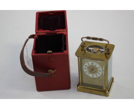 French brass carriage clock with Arabic numerals, in leather carrying case, in working order