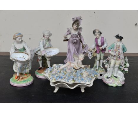 Five continental figurines: a lady and gentleman; sweet dish pair; a gentleman with dog; a gentleman with flower basket and a