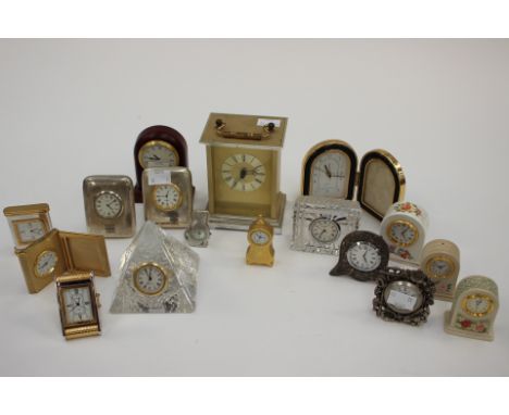 A collection of miniature clocks including a Dartington crystal set clock and a battery operated carriage clock (17) 