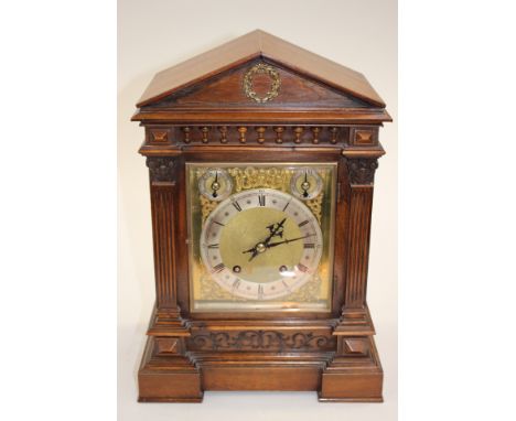 A late 19th Century German oak cased bracket clock by Winterhalder and Hodmeier, the rectangular brass dial with circular cha
