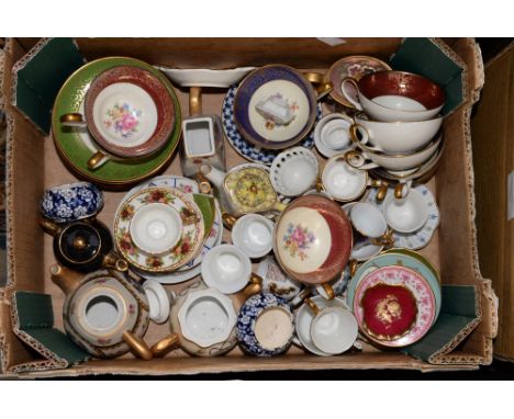 One box containing miniature tea cups, saucers and teapots 