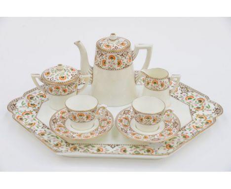 An aesthetic movement coffee service for two on matching tray, comprising two coffee cans and saucers, coffee pot, sugar and 