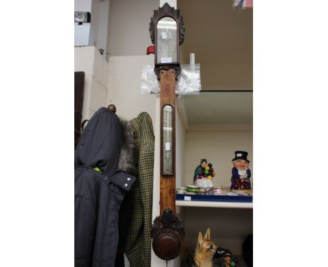 A carved stick barometer 