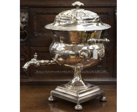 A large silver plated tea urn, wood handles, supported on four bun feet (1)  