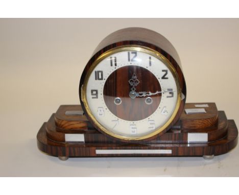 An Art Deco mantle clock, in an oak case