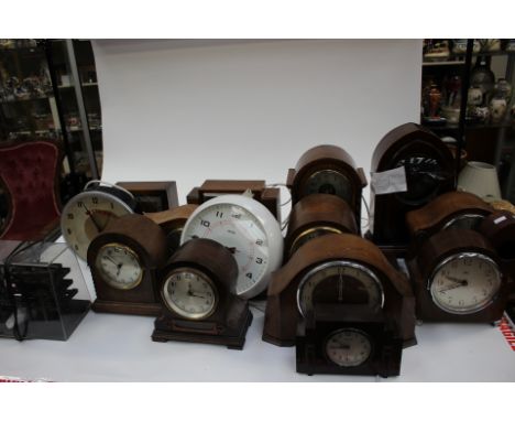 Three boxes containing electric and battery operated mantle and wall clocks to include early 20th Century oak cased clocks, c