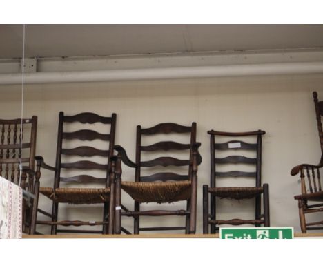 Three rush seated ladder back chairs  