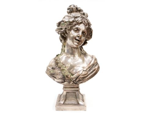 A Continental Art Nouveau electroplated copper bust of a young lady wearing a rose sash, circa 1905, on a tapered square socl