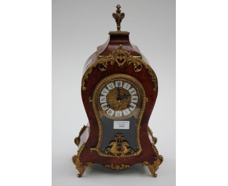 A Louis XIV style modern mantle clock with jouled movement and maple wood finish