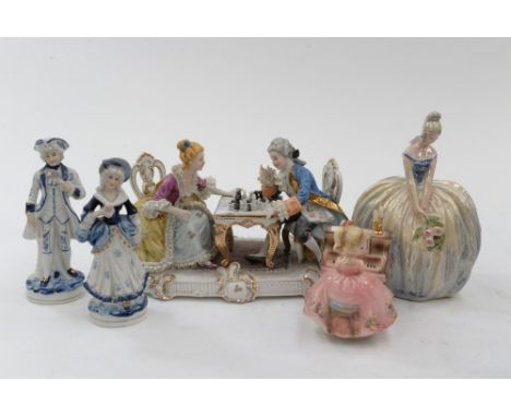 A Dutch lustre figurine with roses, Jema 223, lady and gentleman playing chess, two blue and white figures, and girl playing 