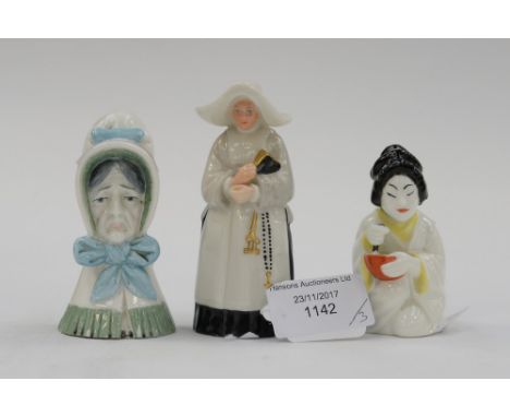 A Royal Worcester porcelain candle snuffer of a nun, together with two later candle snuffers 'Old Woman' and 'Japanese Girl' 