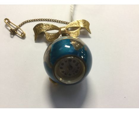 A late 1940s Uno enamel globe ball pendant watch on a 9ct bow brooch, approx size 20mm 