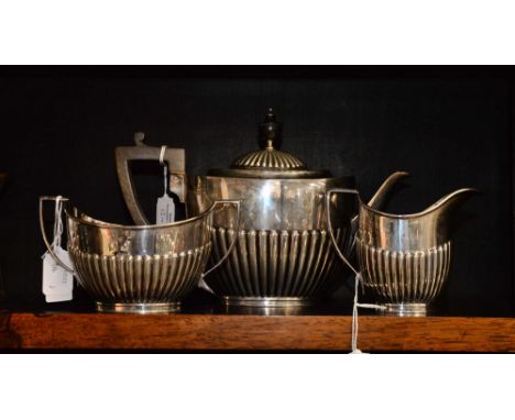 A silver tea service comprising teapot, sugar and milk, London 1907/8, Goldsmiths & Silversmiths Co, gross weight approx 866 