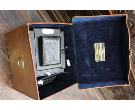 A cased Houghton plate camera, including approx ten plates 