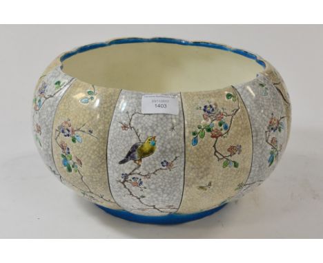 A Longwy style pottery jardiniere with panels of Japanese type foliage and birds 