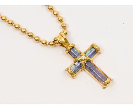 Theo Fennell: a tanzanite and diamond set 18ct gold cross, comprising tanzanite, the gold cross centre set with a small rub o