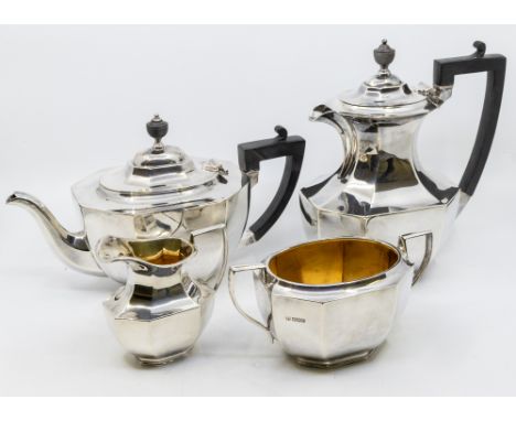 A George V silver four piece tea service comprising teapot, hot water jug, sugar bowl and milk jug, plain octagonal bodies, t