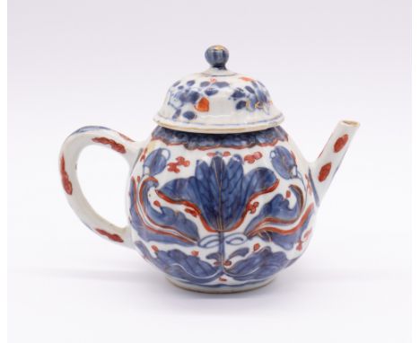 A Chinese Imari ribbed teapot, Kangxi period (1662-1722), the body painted with large central flower and foliage, with water 