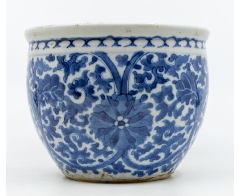 A Chinese blue and white jardiniere, Kangxi four character mark but 19th century, decorated with scrolling flowers, approx 12