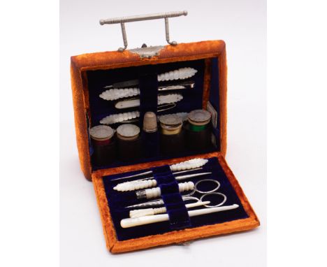 A late Victorian ochre velvet and white metal mounted travelling sewing box, satchel shaped applied with engraved strapwork a