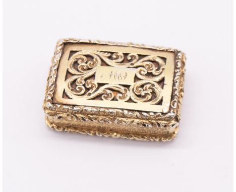 A George IV silver gilt vinaigrette, the cover with scrolling reticulated section with central cartouche engraved with initia