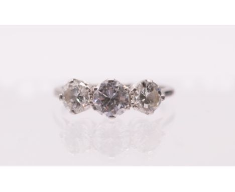 A three stone diamond platinum ring, comprising three graduated round brilliant cut diamonds, total diamond weight approx 1.4