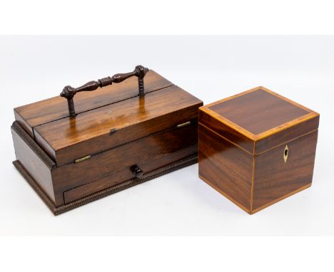 An early 19th Century rosewood travelling desk stand, the rectangular body with central turned carrying handle, the hinged co