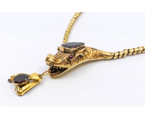 A Victorian gold and garnet set serpent necklace, comprising a graduated fancy link chain, with a serpents head to the front,