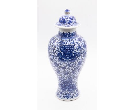 A Chinese blue and white baluster vase and cover, Kangxi Period (1662-1722), the entire decorated with flowers and foliage, u