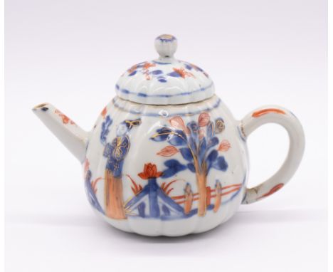 A Chinese Imari ribbed teapot, Kangxi period (1662-1722), the body decorated with two figures on a bridge with trees, flowers