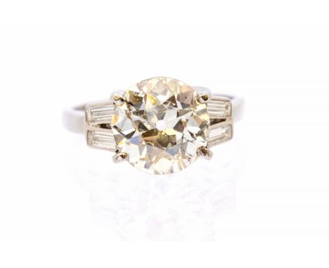 An Art Deco style diamond and  platinum solitaire ring, comprising an old European cut diamond, weighing approx 3.11 carats, 