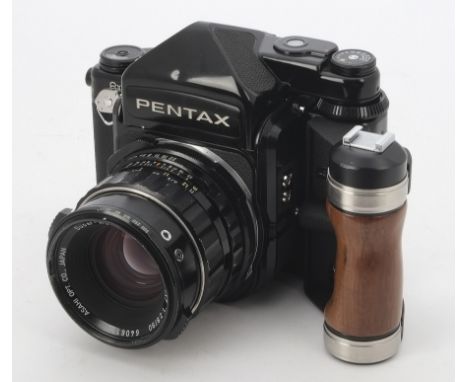 A Asahi Pentax 6X7 SLR Camera, serial no. 4195677, black, metered prism, shutter fires, body, F-G, minor cosmetic ding to pri