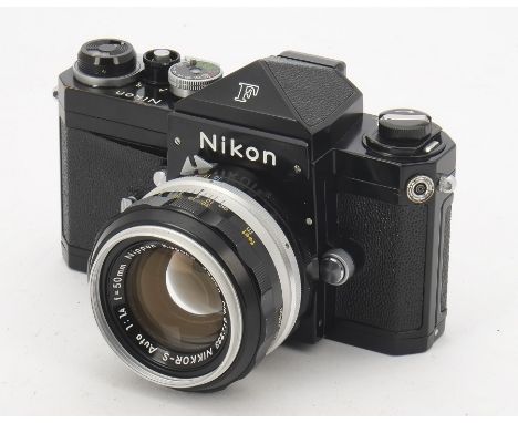 A Nikon F SLR Camera, serial no. 6991450, black, shutter working, body, F-G, leatherette beginning to peel around depth of fi