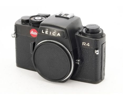 A Leica R4 Body, serial no. 1597734, 1982, black chrome, shutter working, body, F-G, age related marks to bottom plate, with 
