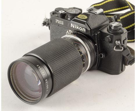 A Nikon FM2 SLR Camera, serial no. 7397540, black, VG, shutter working, with Zoom-Nikkor 35-135mm f/3.5-4.5 lens, no. 261057,