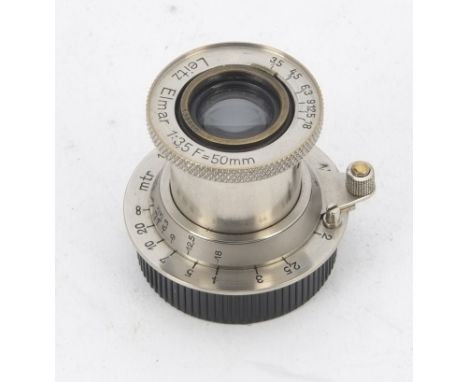 A Leitz 50mm f/3.5 Elmar Lens, serial no. 133118, nickel, bell push, barrel, G, elements, G, light haze and cleaning marks, w