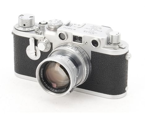 A Leica IIIf Red Dial Delayed Action Camera, serial no.720712, 1954, chrome, shutter working, body, VG-E, with a 5cm f/2 Summ
