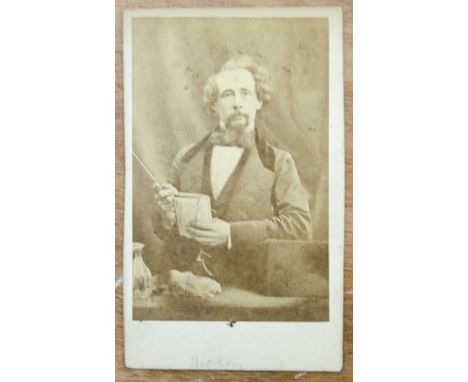 A Herbert Watkins carte-de-Visite Portrait of Charles Dickens,  standing, head turned to left, book in left hand, pencil titl