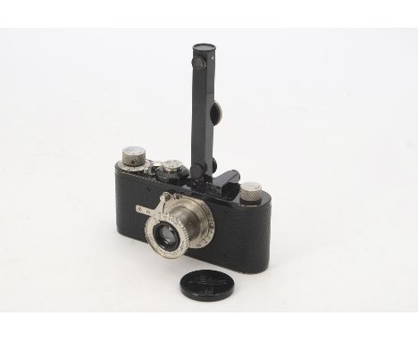 A Leica I Model A Camera, serial no. 13567, 1929, black, dimpled release, body, G, with a close focus 50mm f/3.5 Elmar lens, 