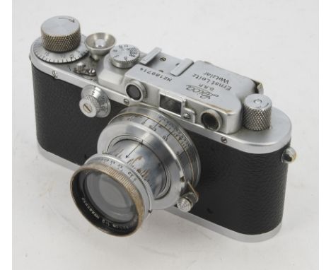 A Leica IIIa Camera, serial no. 189714, 1936, chrome, shutter working, body, P-F, significant signs of damage to top plate ar